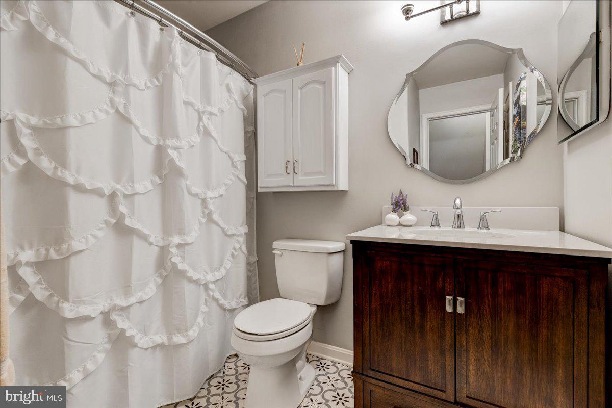 13228 Clipper Circle Solomons, MD 20688 - Photo 27 of 39 Hallway bathroom has updated vanity and flooring