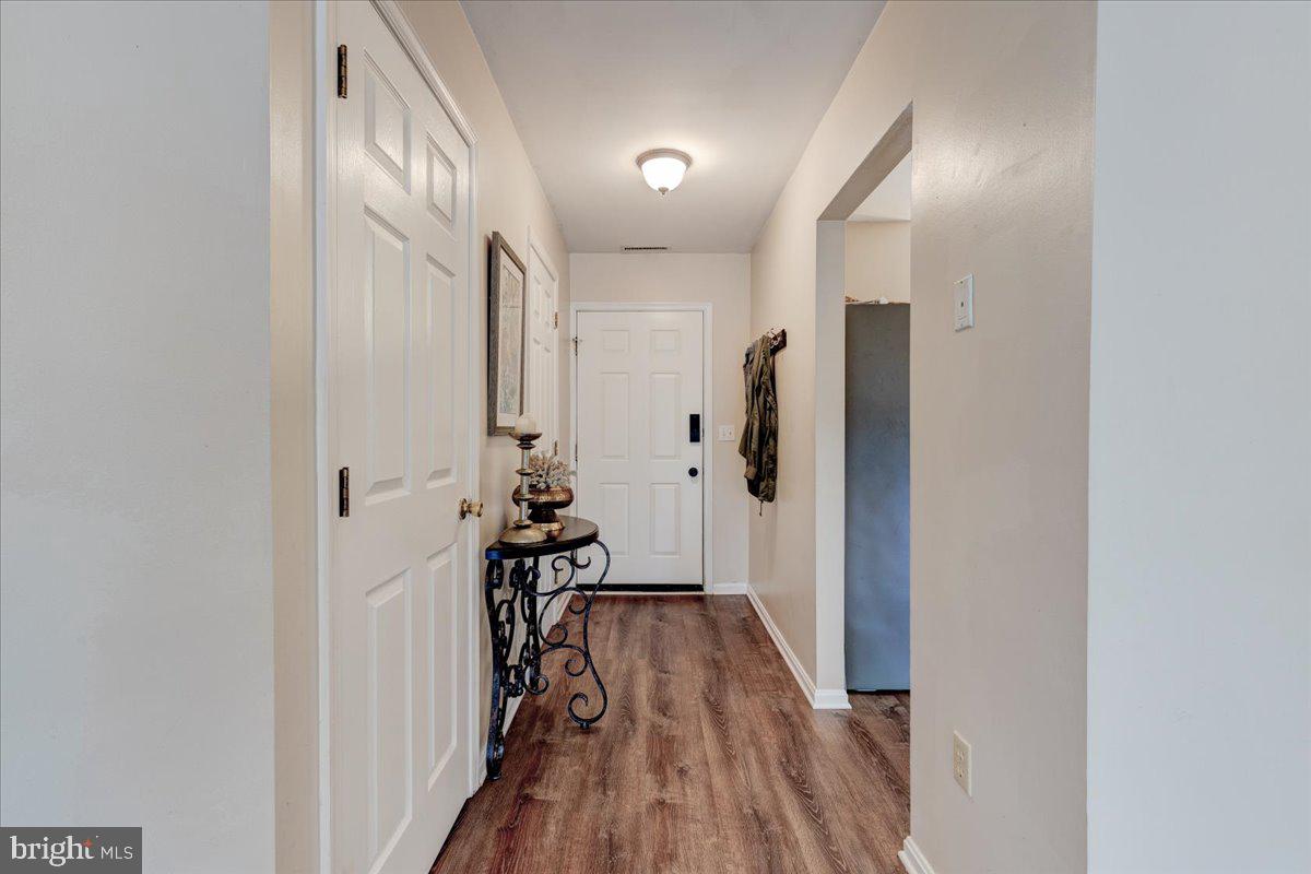 13228 Clipper Circle Solomons, MD 20688 - Photo 5 of 39 Kitchen, 1/2 bath, and large closet off of front h