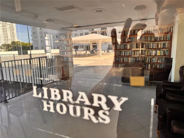 a view of a roof deck with couches and wooden floor