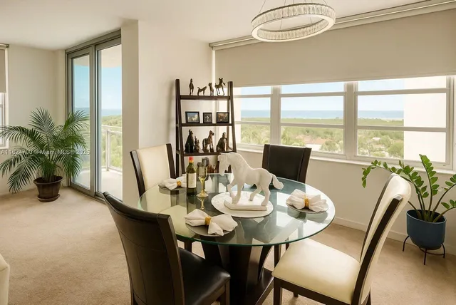 a living room with furniture a flat screen tv and a window