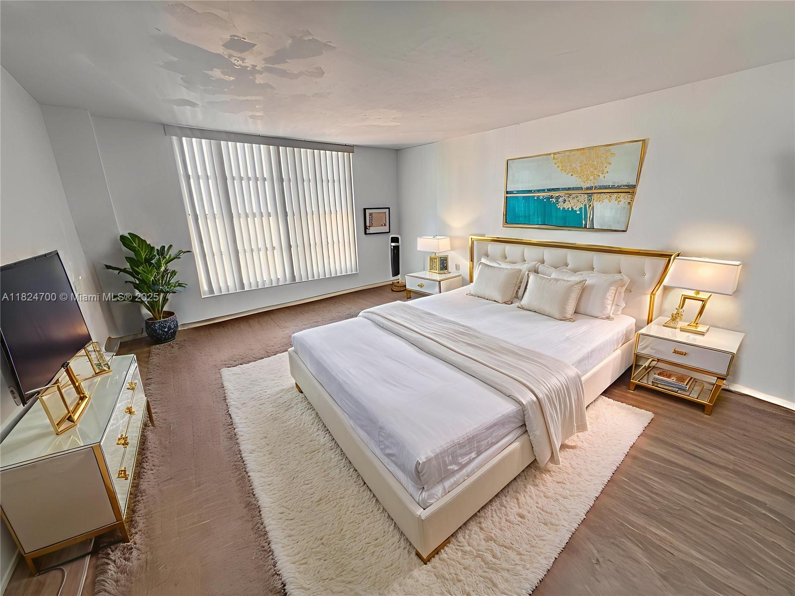 2750 Northeast 183rd Street, Unit 2103 Aventura, FL 33160 - Photo 7 of 30 a bedroom with a bed and a window