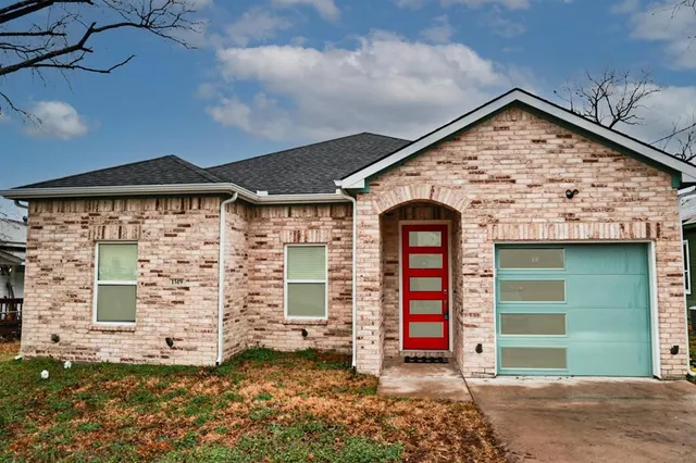 a front view of a house with a garage