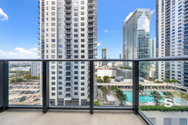 a view of a balcony with outdoor seating