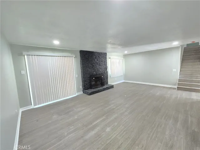 a kitchen with a sink a stove and cabinets