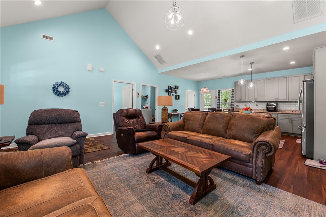 67 Sawblade Ridge Marietta, SC 29661 - Photo 11 of 37 This inviting space features an open concept living area with vaulted ceilings.