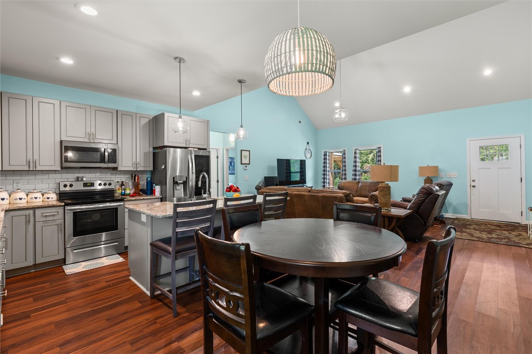67 Sawblade Ridge Marietta, SC 29661 - Photo 12 of 37 This inviting space offers a seamless flow between the kitchen, dining, and living areas.