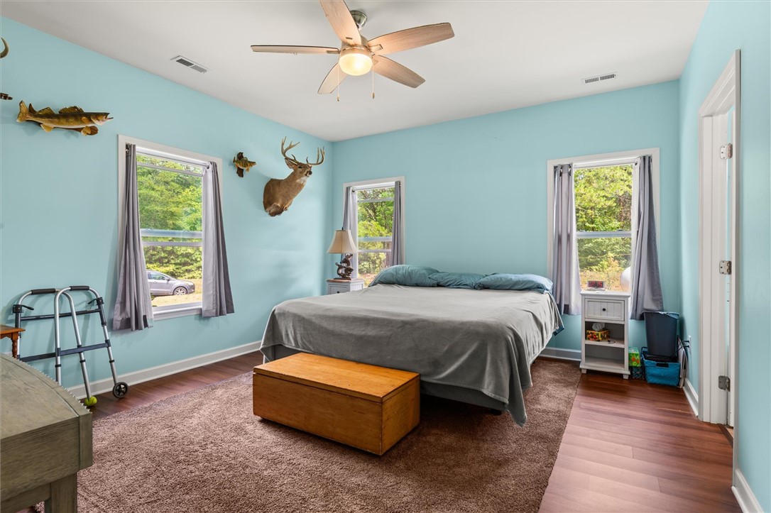 67 Sawblade Ridge Marietta, SC 29661 - Photo 14 of 37 A comforting bedroom with bright walls and rich flooring, perfect for peaceful slumber.
