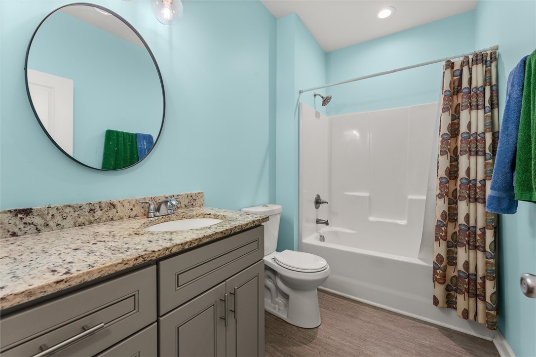 67 Sawblade Ridge Marietta, SC 29661 - Photo 20 of 37 This bathroom features a sleek vanity, a convenient shower, and a clean, modern design.