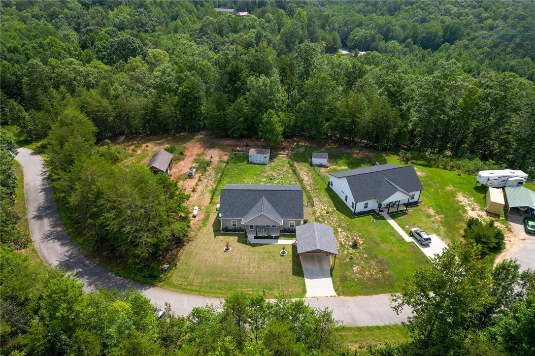 67 Sawblade Ridge Marietta, SC 29661 - Photo 27 of 37 This verdant retreat offers expansive natural surroundings and a welcoming residence.
