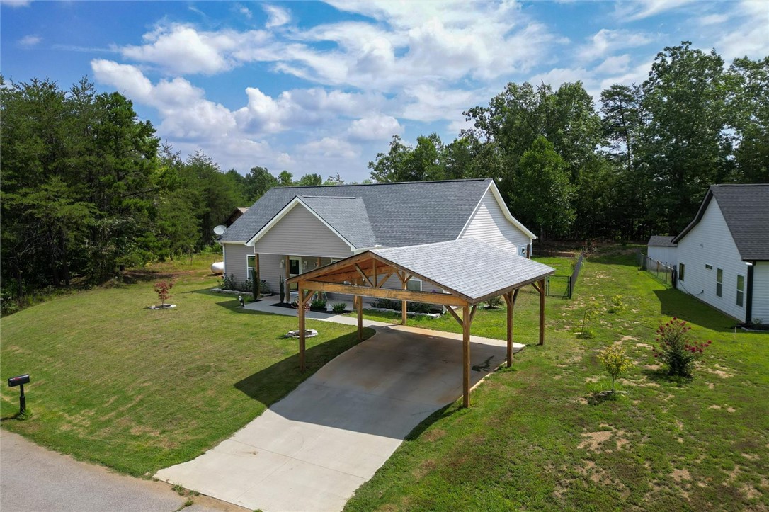 67 Sawblade Ridge Marietta, SC 29661 - Photo 31 of 37 This charming home features a convenient carport and a spacious, verdant yard.