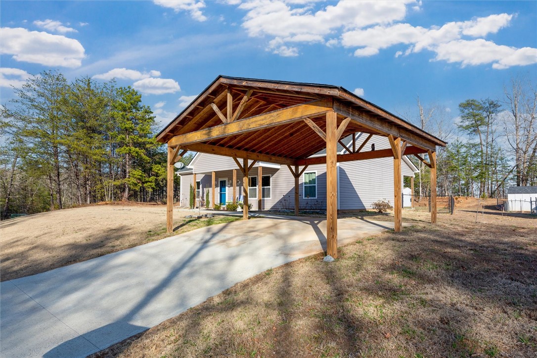 67 Sawblade Ridge Marietta, SC 29661 - Photo 32 of 37 This charming home offers a convenient carport and ample outdoor space, perfect for comfortable living.