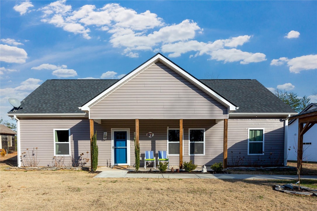 67 Sawblade Ridge Marietta, SC 29661 - Photo 37 of 37 This charming home offers a welcoming facade with a cozy porch, perfect for enjoying quiet moments.