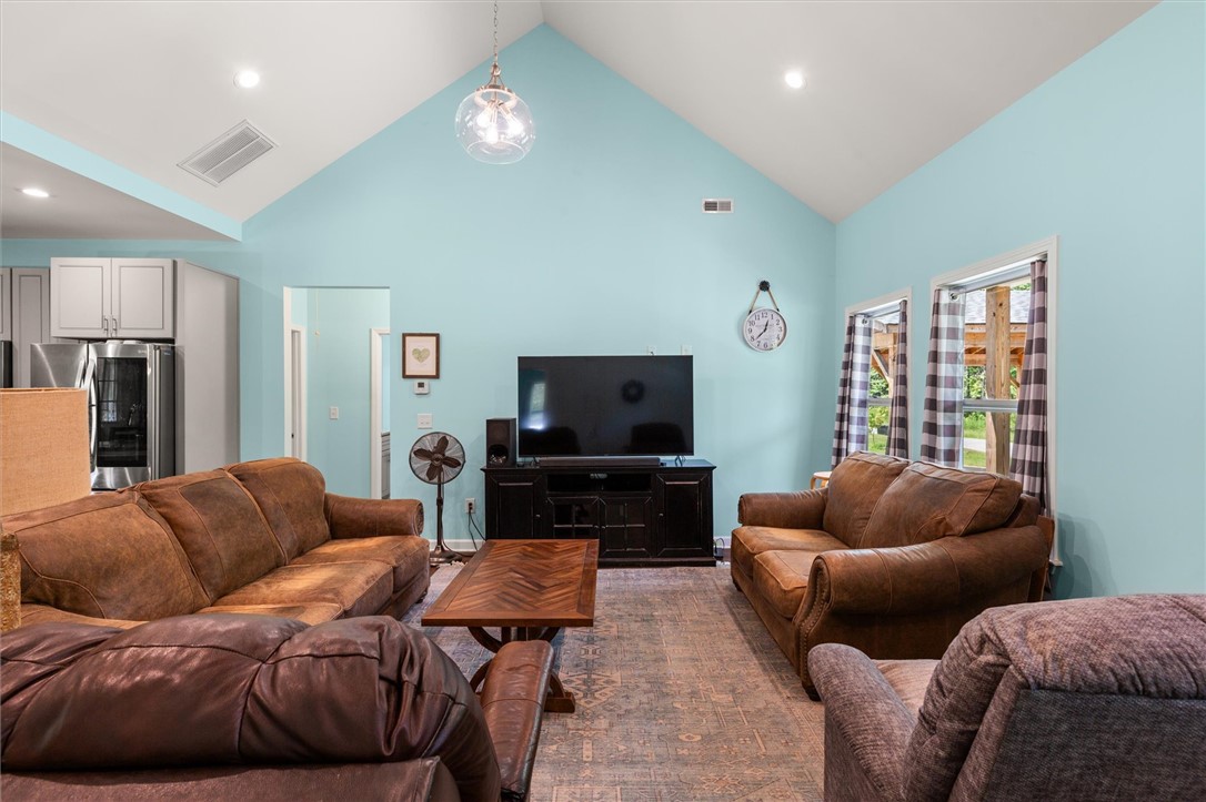 67 Sawblade Ridge Marietta, SC 29661 - Photo 4 of 37 This airy living space features soaring vaulted ceilings and abundant natural light.