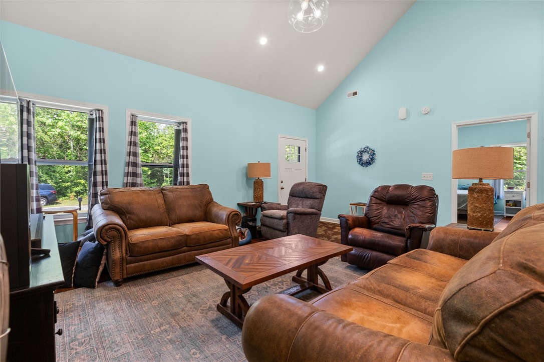 67 Sawblade Ridge Marietta, SC 29661 - Photo 10 of 37 This inviting living space features high ceilings and abundant natural light.