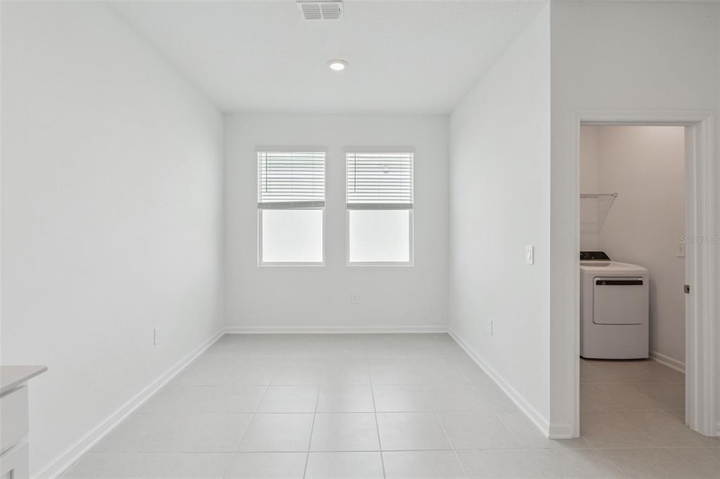 1672 Rider Rain Lane Apopka, FL 32703 - Photo 23 of 35 an empty room with a empty space and a window