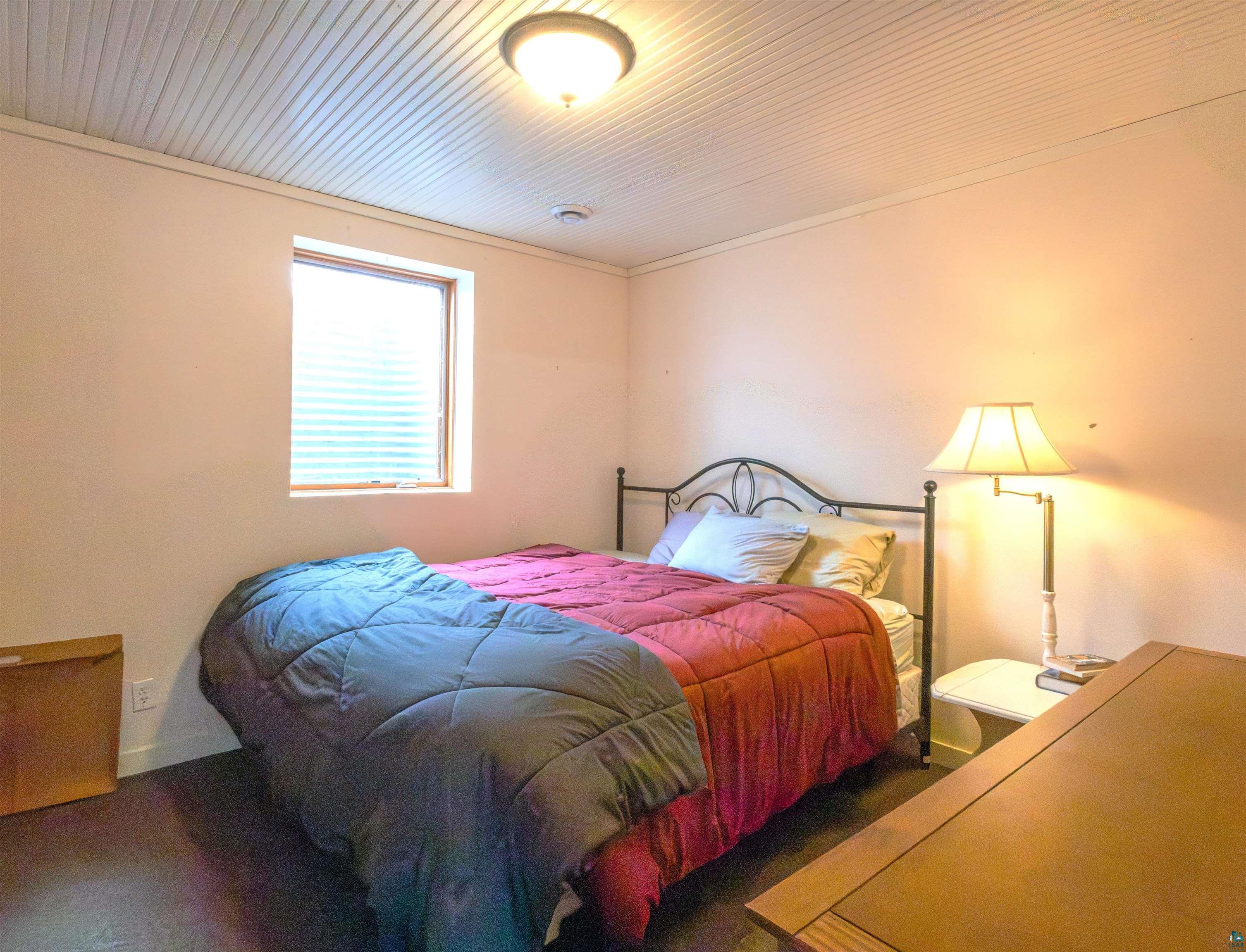 20210 Siskiwit Lake Road Cornucopia, WI 54827 - Photo 29 of 40 lower level bedroom