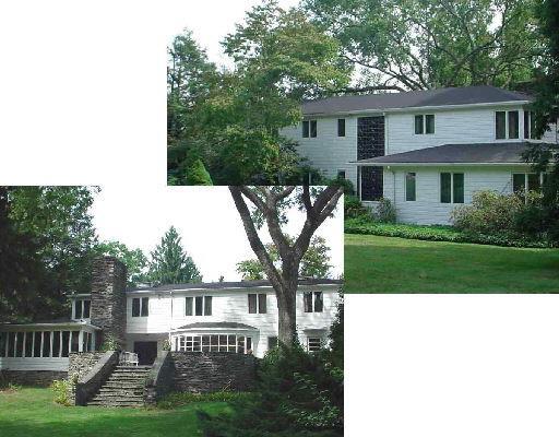 115 West Meadow Road Wilton, CT 06897 - Photo 1 of 1 a front view of a house with a yard