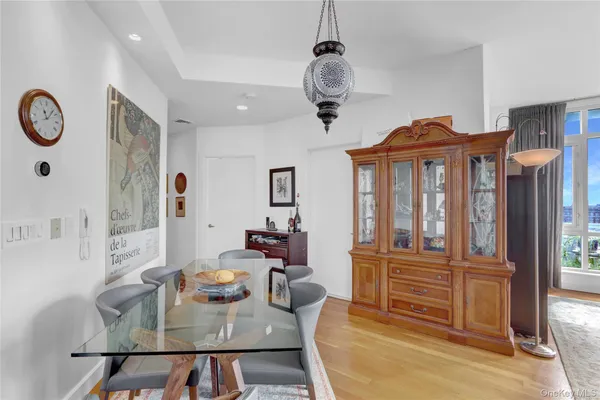 a view of a living room and chandelier
