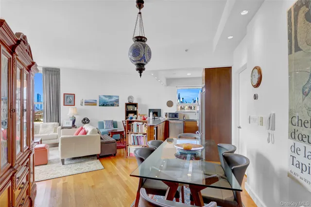 a view of a dining room with furniture window and wooden floor