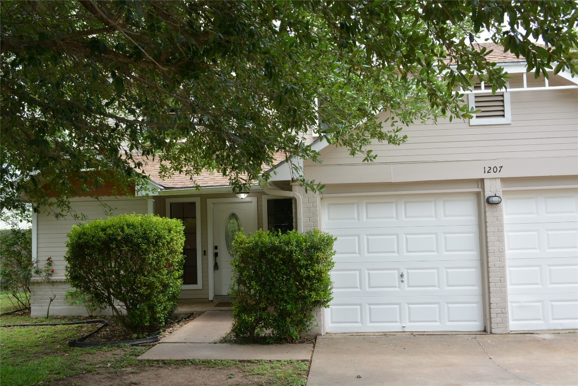 1207 Crupp Court Austin, TX 78753 - Photo 3 of 11 front view of house with potted plants