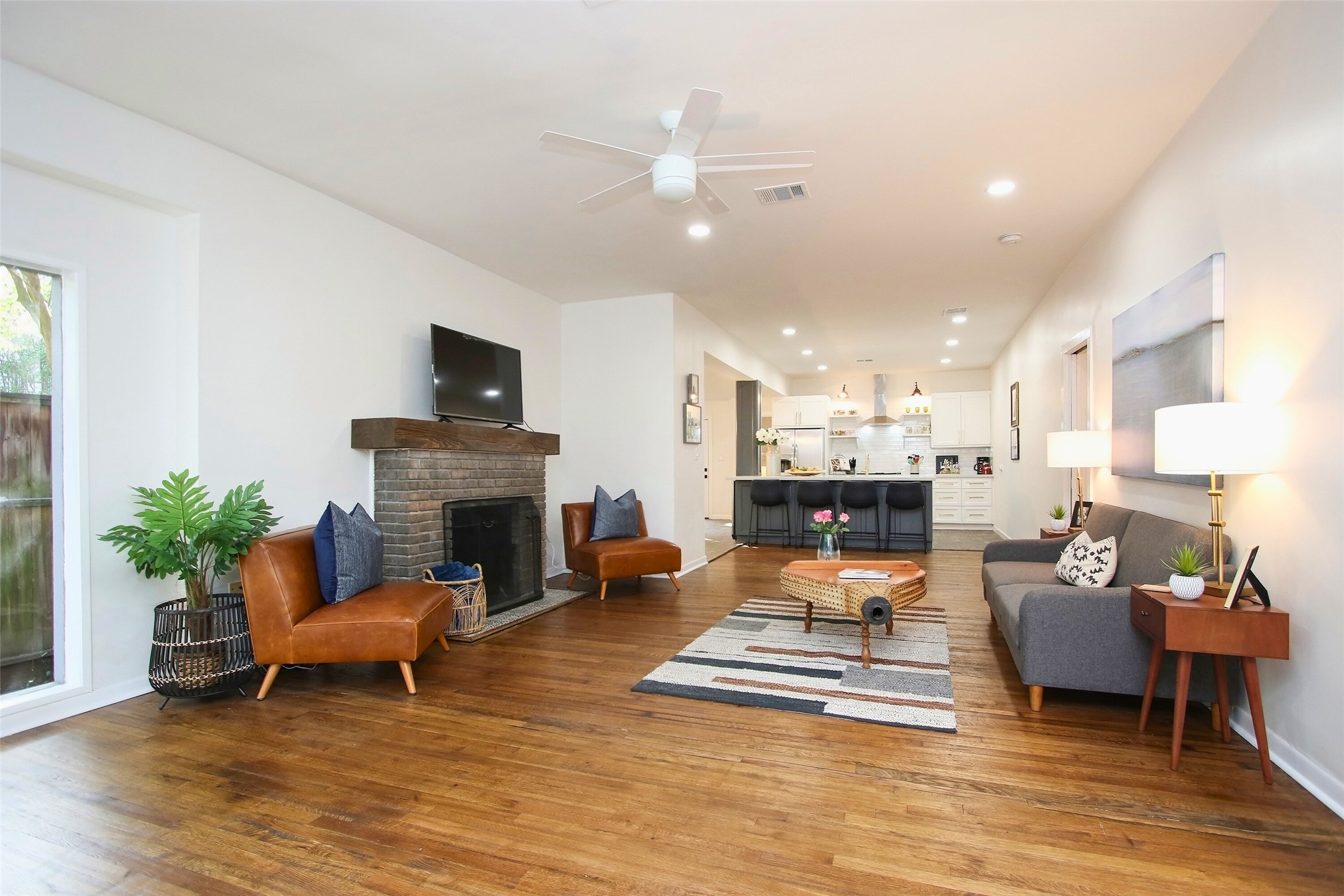 1818 Haver Street Houston, TX 77006 - Photo 11 of 28 a living room with furniture and a fireplace