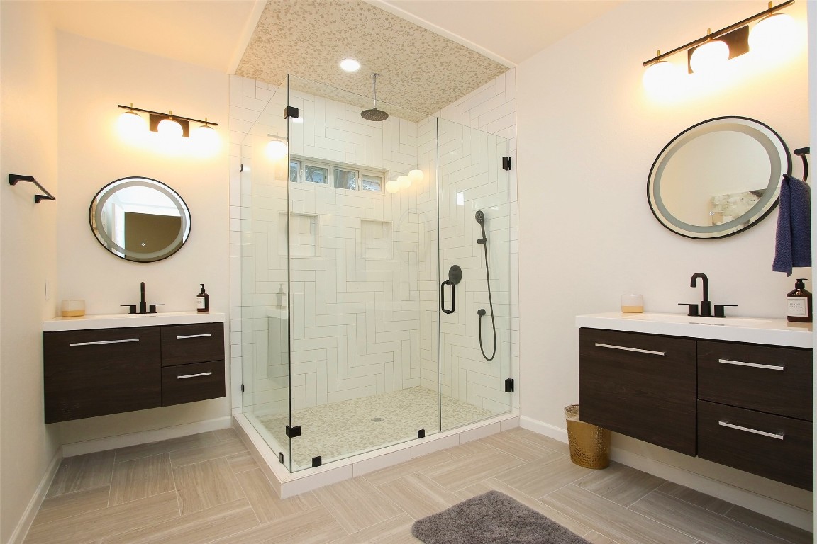 1818 Haver Street Houston, TX 77006 - Photo 15 of 28 a bathroom with a sink a toilet and a mirror