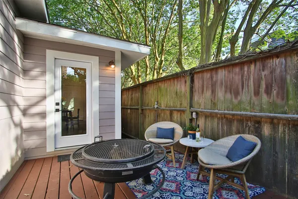 a backyard of a house with table and chairs