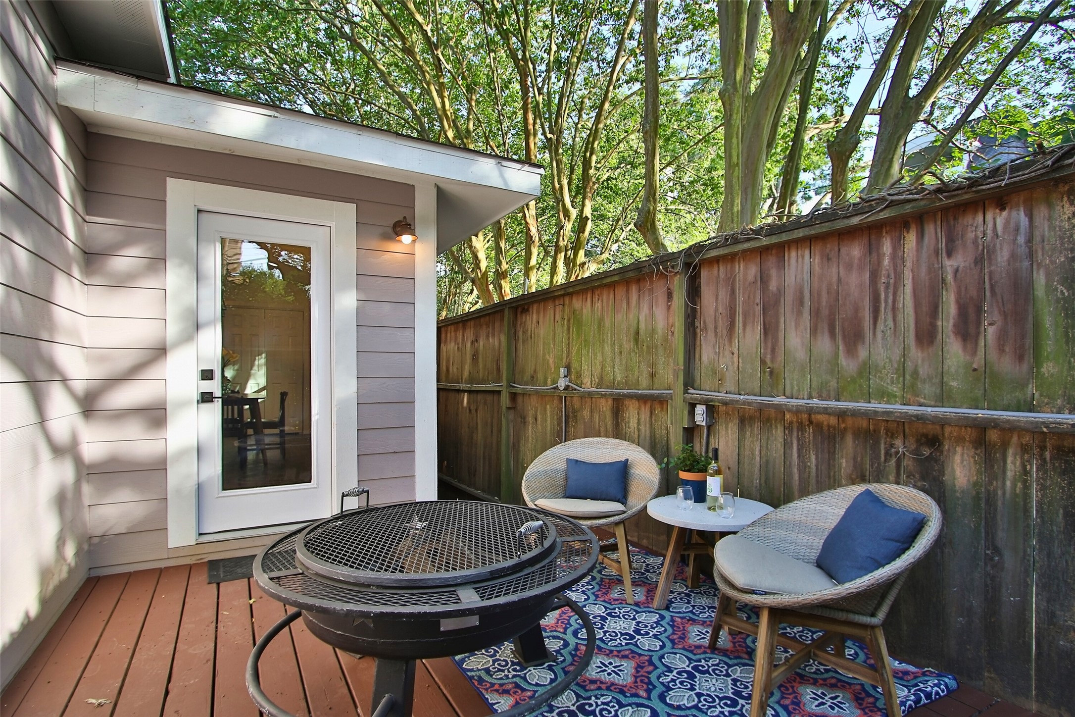 1818 Haver Street Houston, TX 77006 - Photo 21 of 28 a backyard of a house with table and chairs