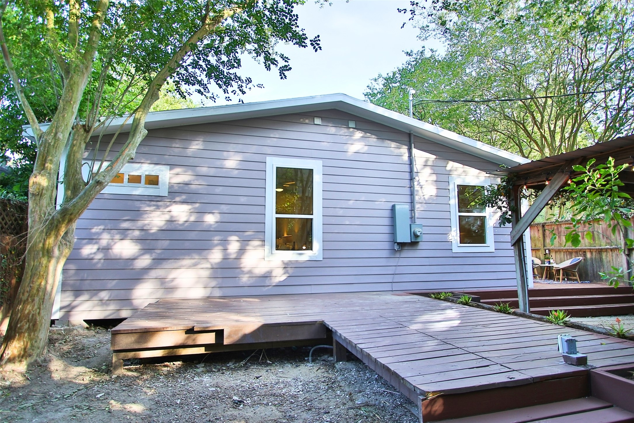 1818 Haver Street Houston, TX 77006 - Photo 24 of 28 a brick house with a large window and wooden floor