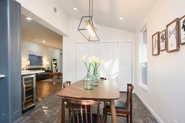 a kitchen with a table and chairs in it