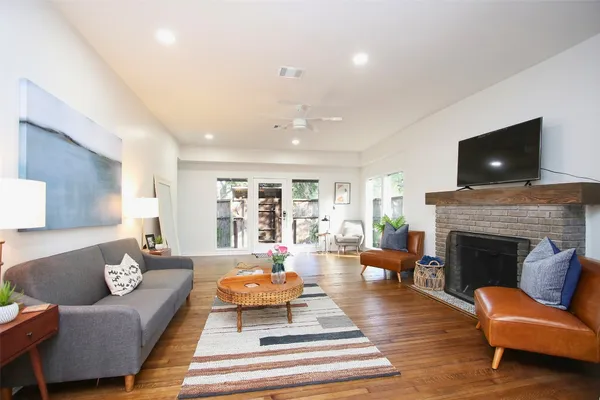 a living room with furniture and a fireplace