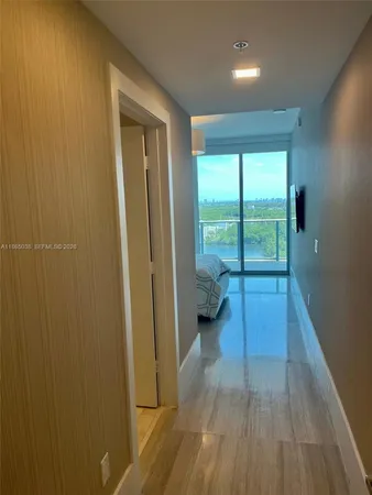 a view of a room with wooden floor and balcony