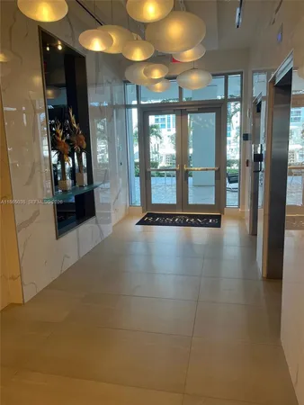 a view of an entryway with a carpet