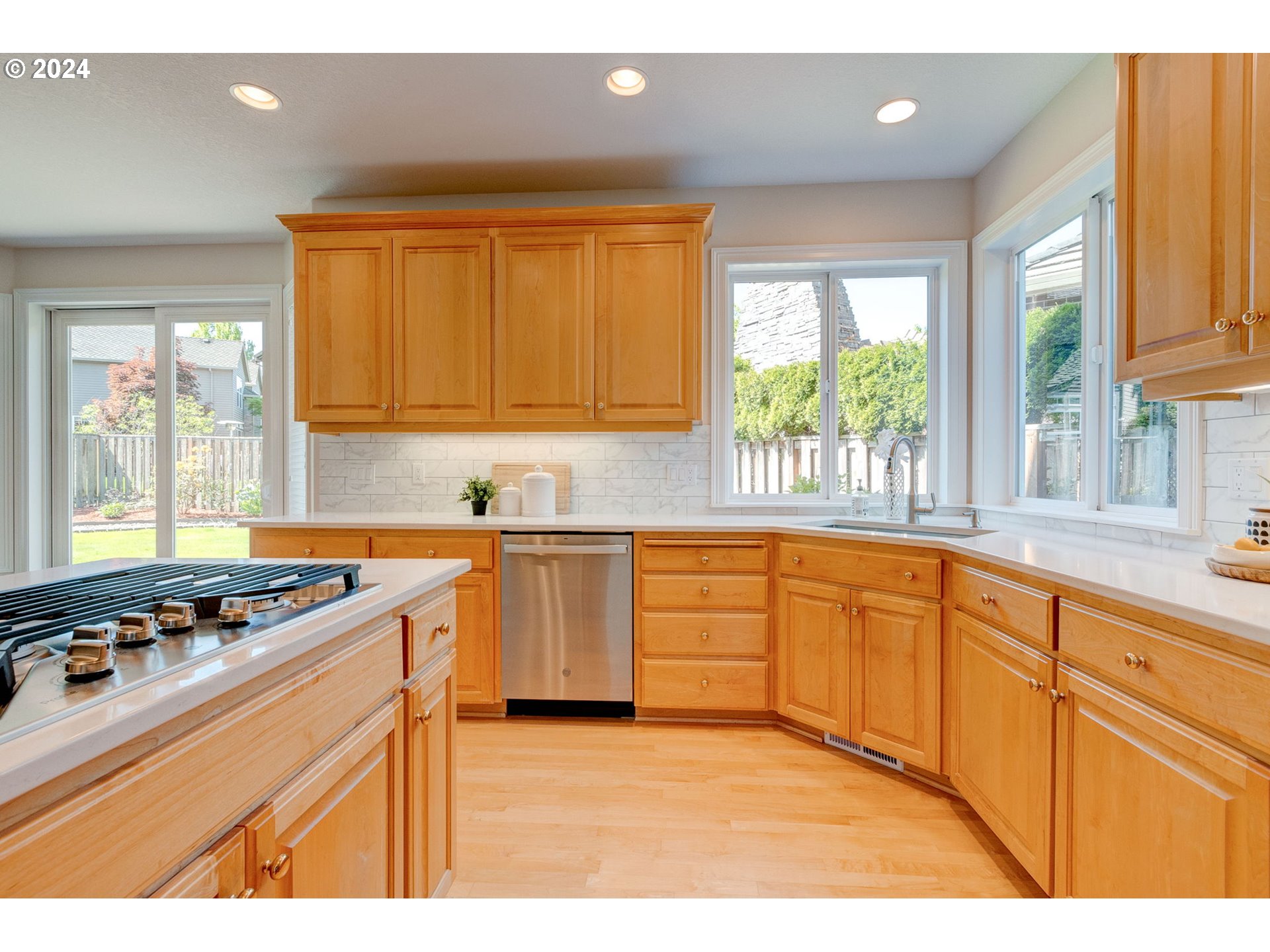 16610 Northwest Mission Oaks Drive Beaverton, OR 97006 - Photo 11 of 37 a kitchen with stainless steel appliances granite countertop a stove a sink dishwasher and a microwave