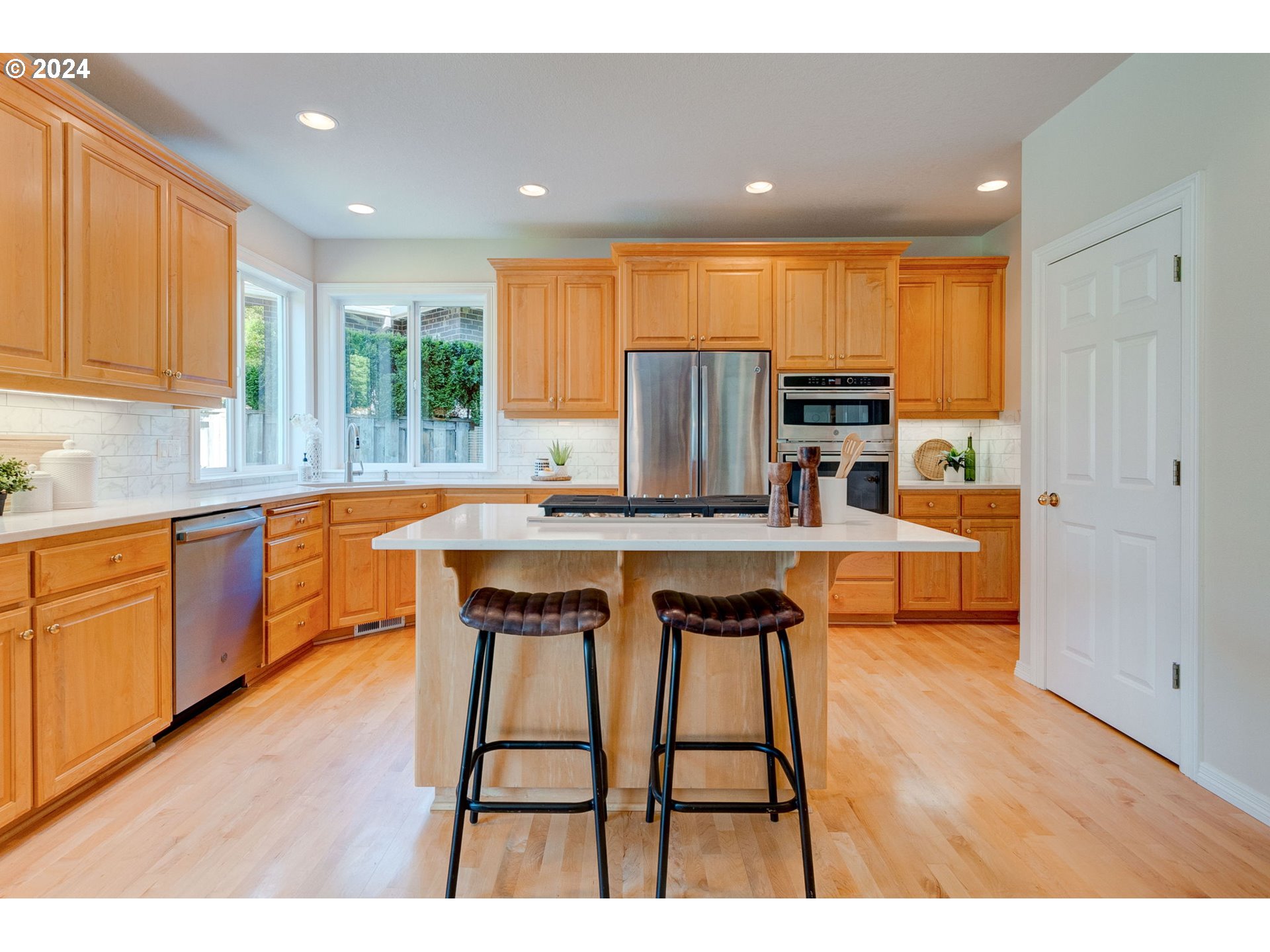 16610 Northwest Mission Oaks Drive Beaverton, OR 97006 - Photo 13 of 37 a kitchen with stainless steel appliances granite countertop a refrigerator and a sink