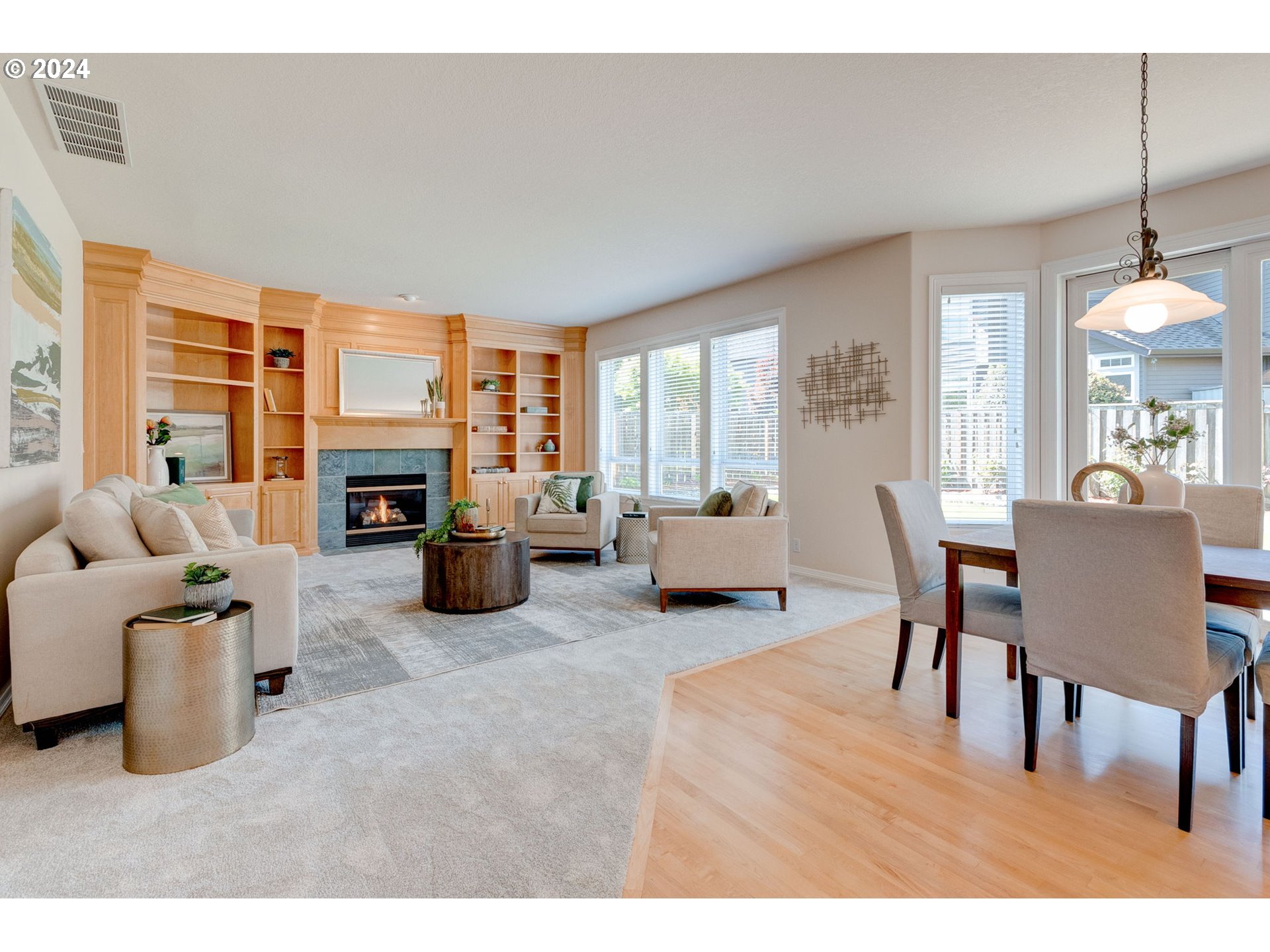 16610 Northwest Mission Oaks Drive Beaverton, OR 97006 - Photo 16 of 37 a living room with furniture a fireplace and a table