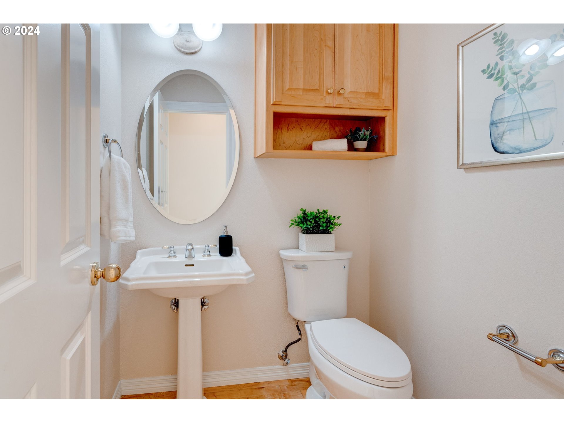 16610 Northwest Mission Oaks Drive Beaverton, OR 97006 - Photo 19 of 37 a bathroom with a toilet a sink and a mirror