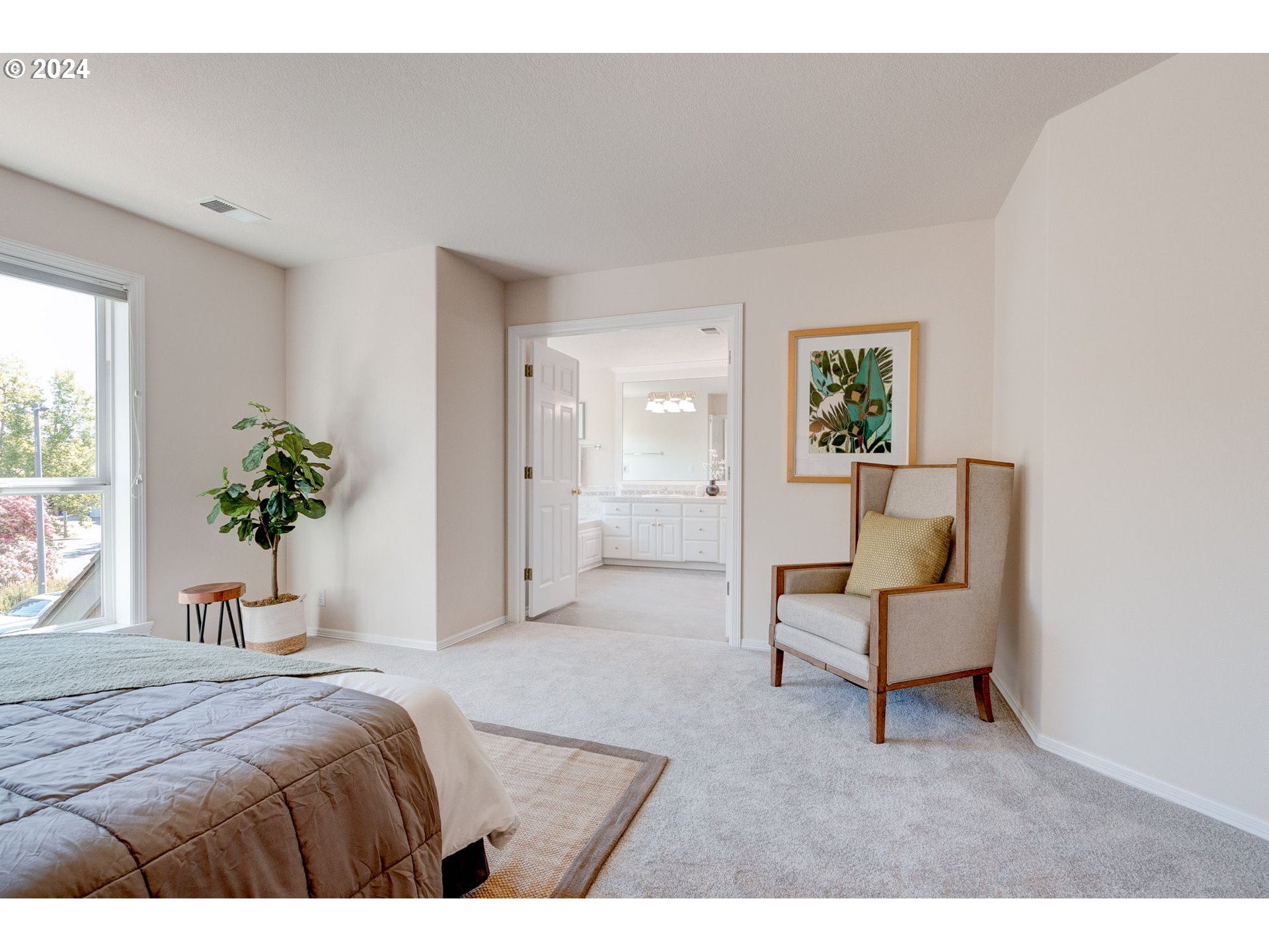 16610 Northwest Mission Oaks Drive Beaverton, OR 97006 - Photo 22 of 37 a bedroom with a bed and a chair