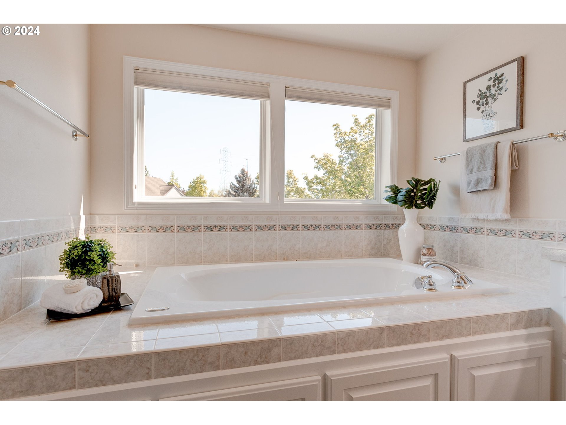 16610 Northwest Mission Oaks Drive Beaverton, OR 97006 - Photo 24 of 37 a bathroom with a bathtub sink and window