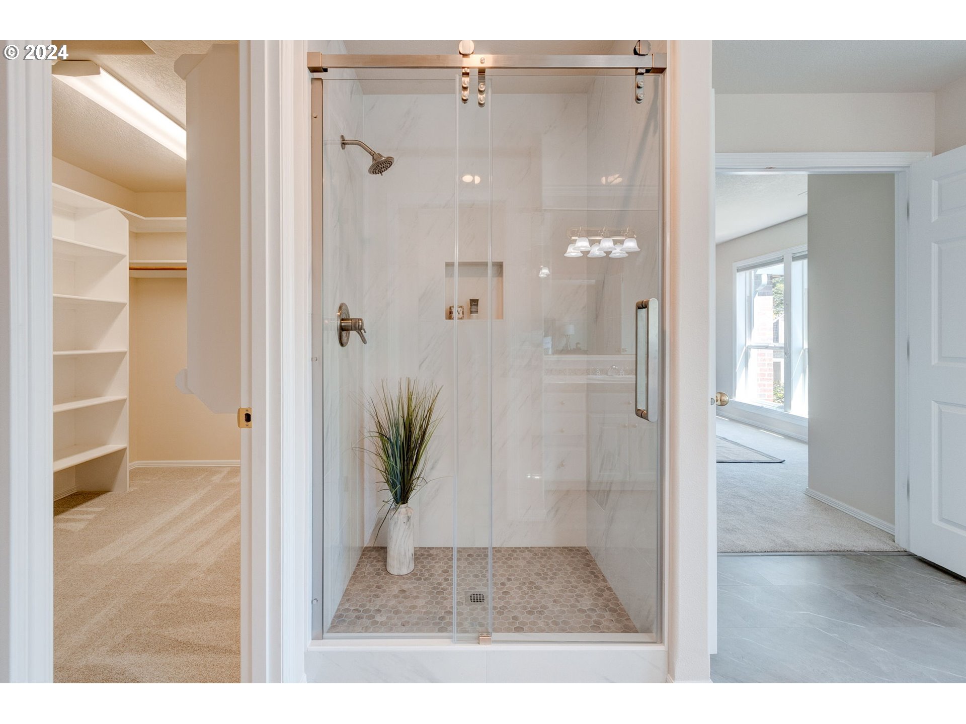 16610 Northwest Mission Oaks Drive Beaverton, OR 97006 - Photo 27 of 37 a bathroom with a glass shower door