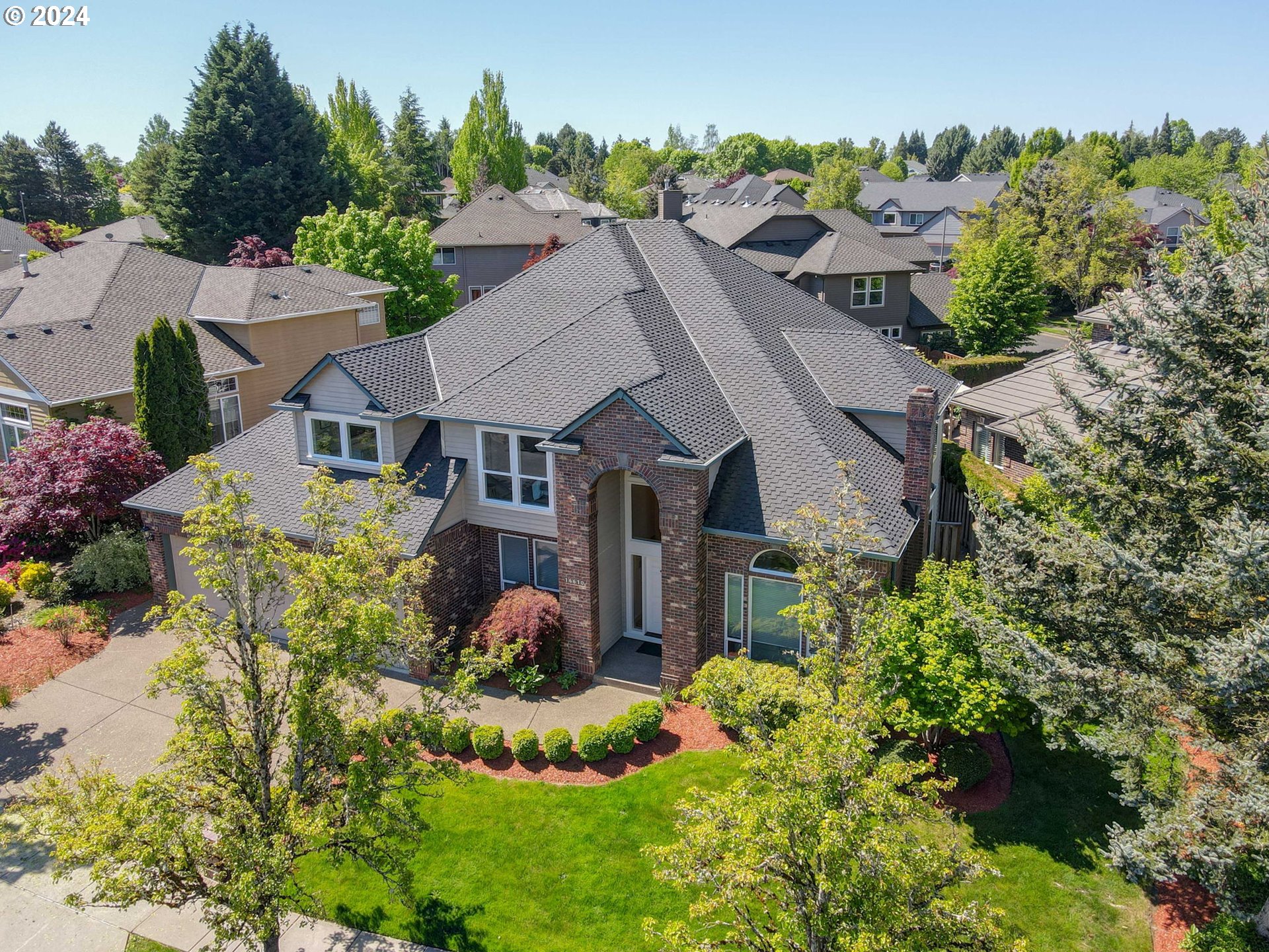 16610 Northwest Mission Oaks Drive Beaverton, OR 97006 - Photo 34 of 37 an aerial view of a house with a big yard and potted plants