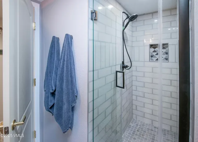 a bathroom with a sink vanity and mirror