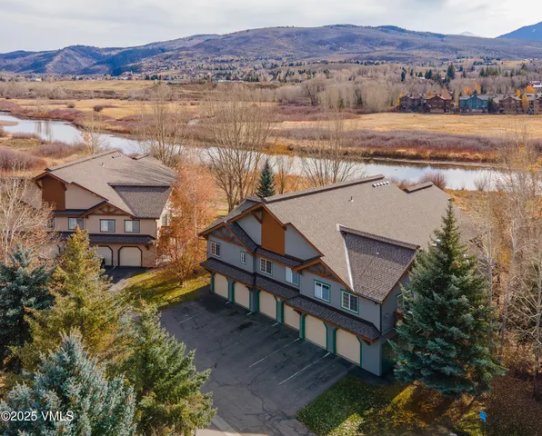 an aerial view of a house with a lake view
