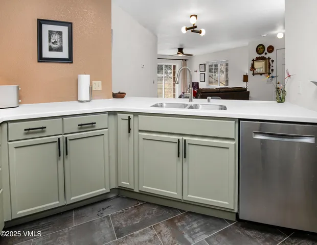 a spacious bathroom with a sink and cabinets
