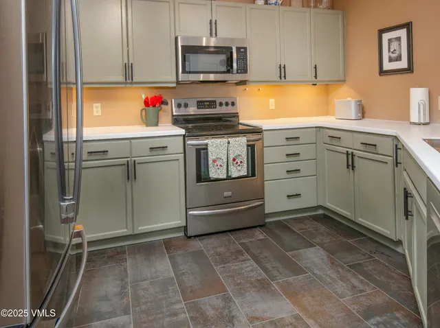 a kitchen with a stove and a sink
