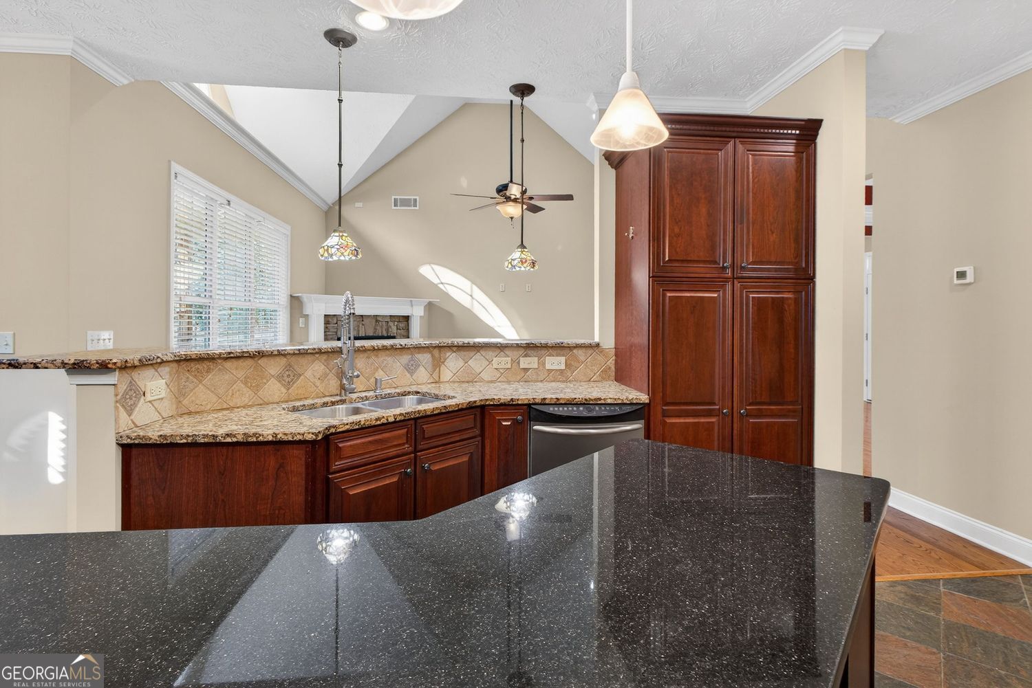 206 Jack Maddox Bridge Road Jackson, GA 30233 - Photo 12 of 38 a kitchen with stainless steel appliances granite countertop a sink a stove and a wooden floor
