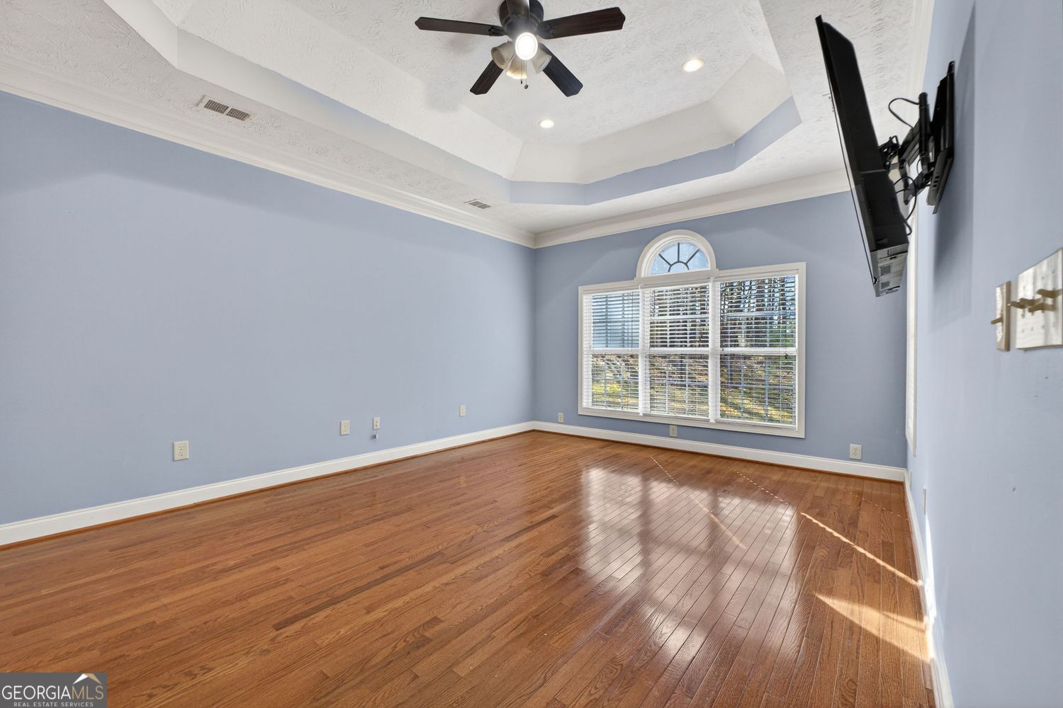 206 Jack Maddox Bridge Road Jackson, GA 30233 - Photo 18 of 38 a view of an empty room with a window and wooden floor
