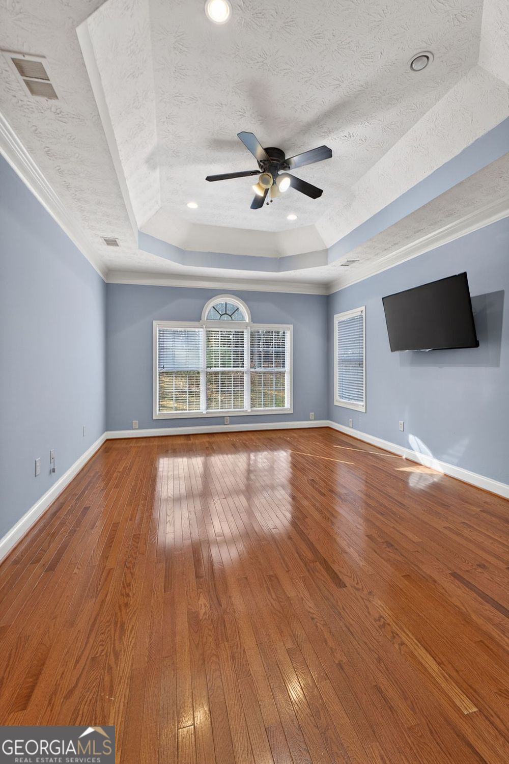 206 Jack Maddox Bridge Road Jackson, GA 30233 - Photo 19 of 38 a view of an empty room with wooden floor and a window