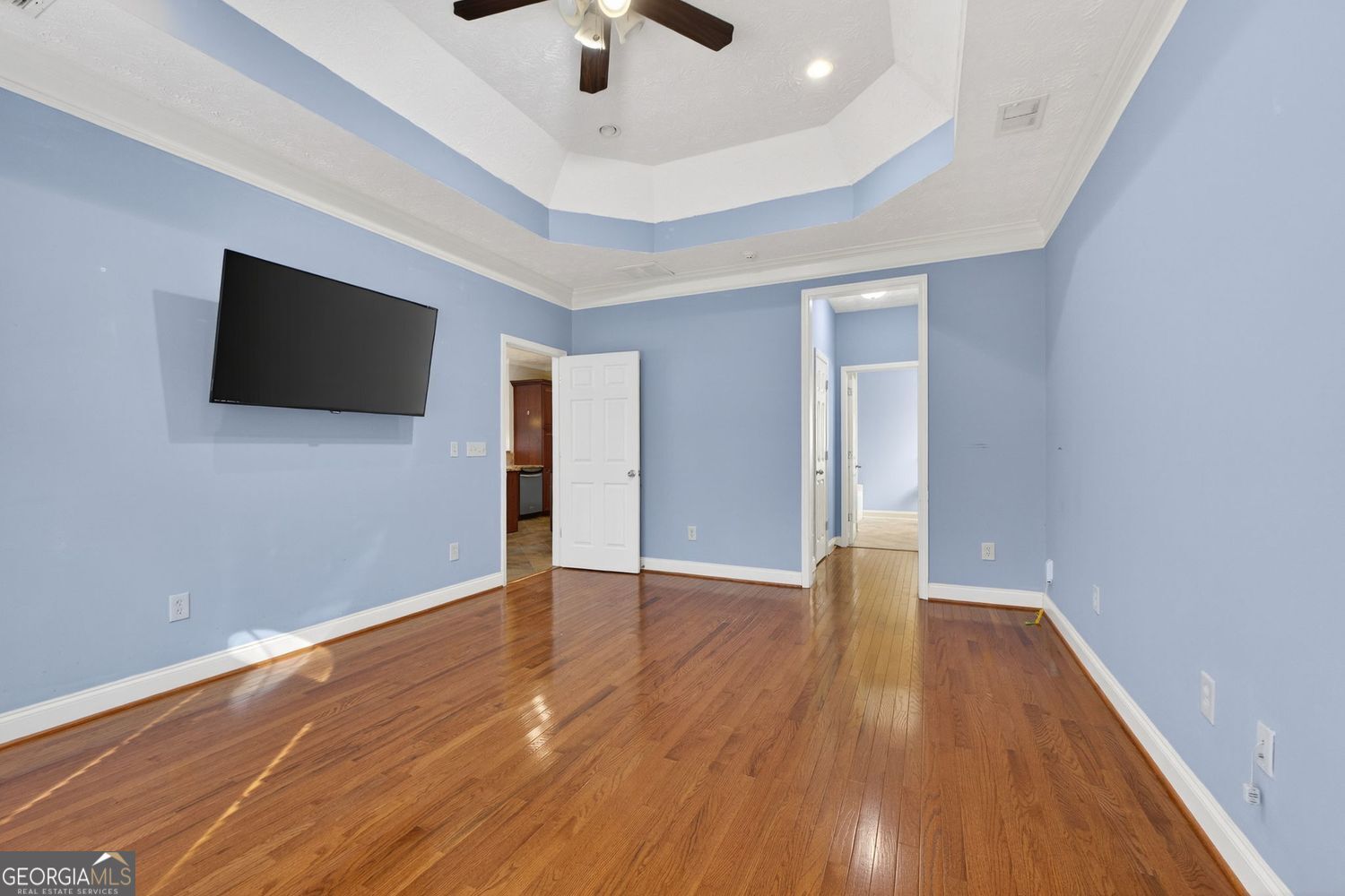 206 Jack Maddox Bridge Road Jackson, GA 30233 - Photo 20 of 38 an empty room with wooden floor and chandelier fan