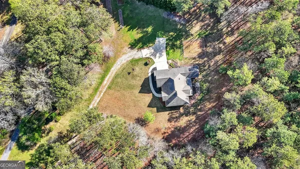 a backyard of a house with lots of green space